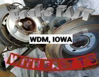 Worn out brake rotors that Fast T's Brake Service removed leaning together 