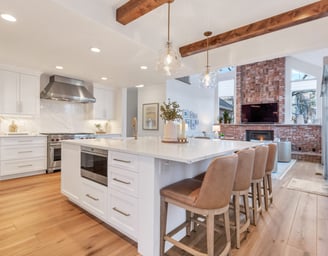 a kitchen with a large island and a fireplace