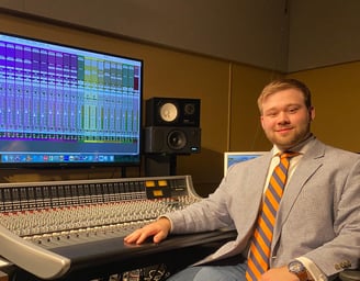 Andrew Wimple posing in front of a SSL 948 delta console.