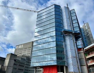 a building with a crane in the background