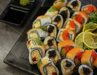 A plate full of different sushi