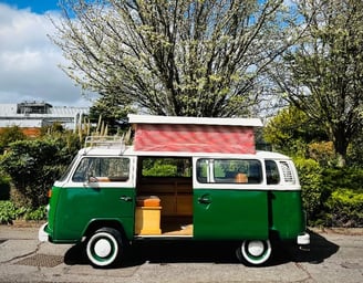 Classic green Camper van with roof tent