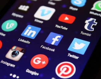 a cell phone with a bunch of social media icons