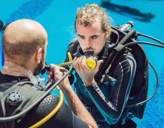 a man in a scuba suit is getting ready to go scuba