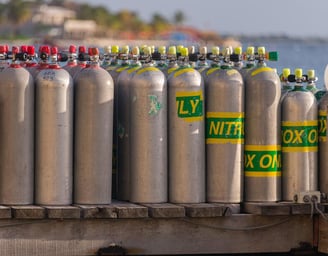 a bunch of gas bottles of gas on a trailer
