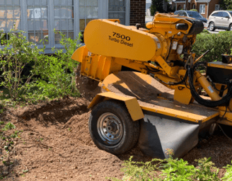 a machine is being used to remove dirt from the ground