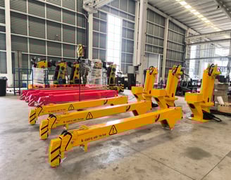 Yellow SQS42A-3 (2-ton telescopic) small truck mounted cranes on production floor.