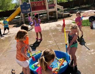 a group of children playing in preschool in Reno