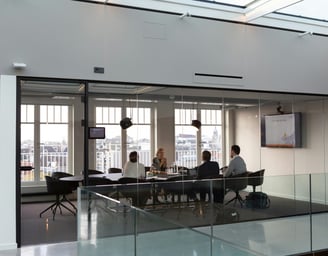Business Meeting in a Glass Room