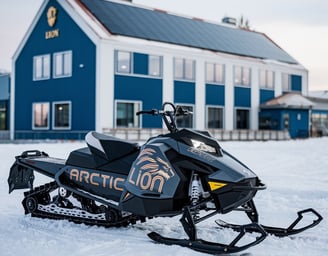 a snowmobile parked in front of a blue house