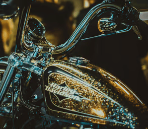 a motorcycle with a shiny gold paint and a shiny chromed motorcycle