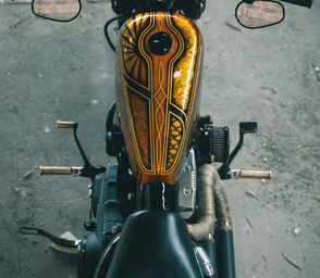 a motorcycle with a wooden handlebars and a wooden handlebar