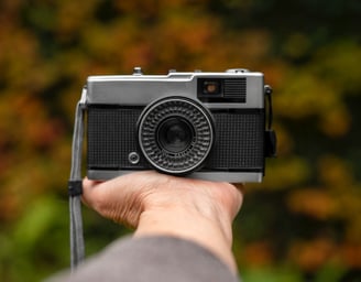 a person holding a camera in his hand