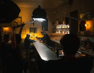 Film crew filming TV shot for a whisky in a Prague bar