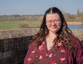 kate-accounts-manager-at-artful-accountancy-wearing-a-dress-and-cardigan-head-and-shoulders-standing