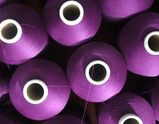 Purple yarn cones from top view