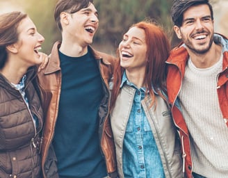 a group of friends laughing and laughing together