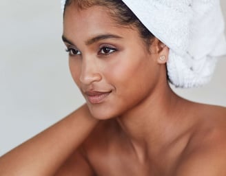 a woman with a towel on her head