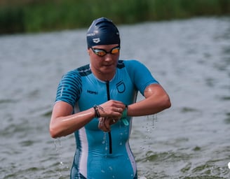 enduranceID with Dasha in the water finishing the swim part on a triathlon event