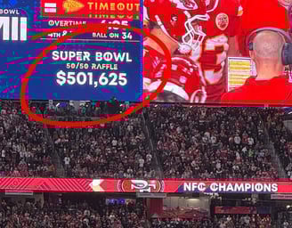 a football player is shown on a large screen