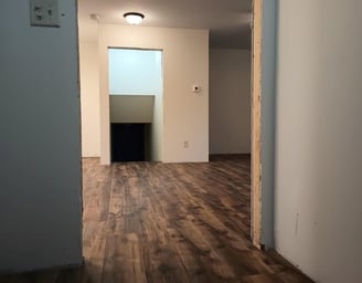 New vinyl laminate flooring was spread throughout this house in Goshen, IN, while being remodeled.