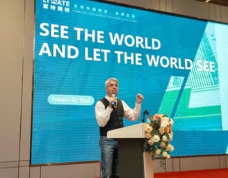 a man standing at a podium with a microphone