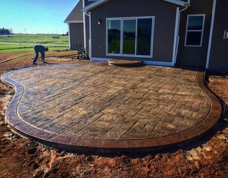 a patio with a brick patio with a brick patio