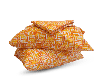a stack of pillows with a pattern on them- cotton bedsheet