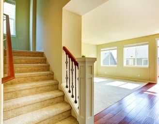 a staircase way with a wooden floor and stairs