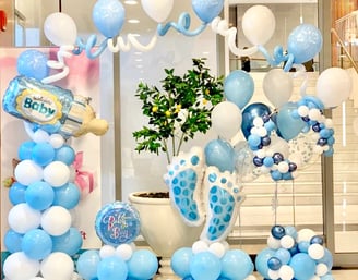 a baby shower party with balloons and balloons