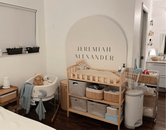 Organized nursery corner with labeled baskets, changing station, and soft neutral decor.
