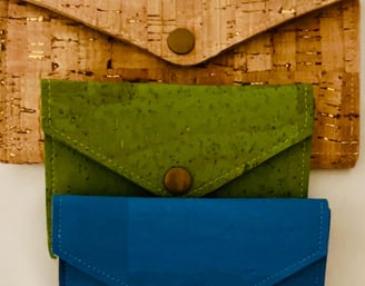 three wallets constructed of cork using Spencer Ogg's Corkodian pattern