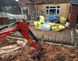 a red excavator with a red excavator on it