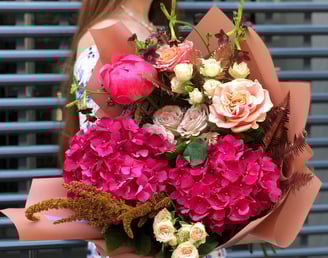 a woman holding a bouquet of flowers