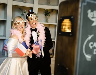 Bride and her borther enjoying photobooth during elegant Provence wedding