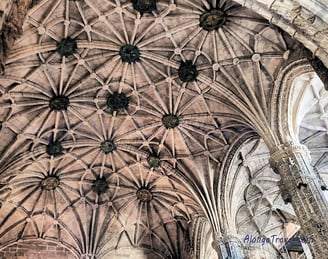 a large cathedral style vaulted ceiling with multiple but simple decorations  