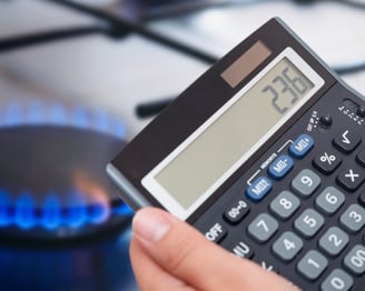 a person holding a calculator and a calculator