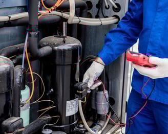 a man in a blue uniform is holding a red object