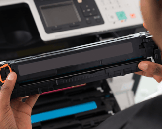 a person holding a printer and a printer