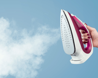 a person holding a steam iron iron iron iron iron iron iron iron iron iron iron