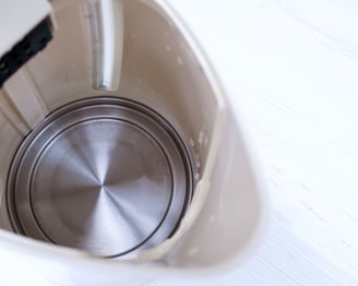 a blender with a metal bowl and a metal bowl