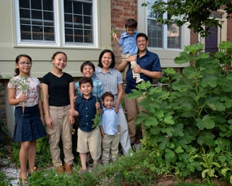 The Schauder family poses in their front yard garden.