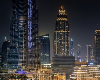a cityscape of a city with a fountain in the foreground Dubai fountain burj khalifa