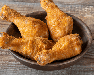 a bowl of crispy baked chicken drums