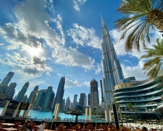 a view of a city skyline with a tall building in the background