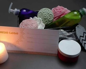 a box of soaps and candles on a table