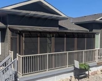 Screen Room with patio cover built behind the railing.