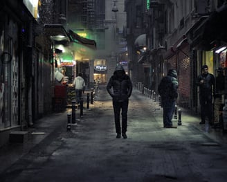 a person walking down a street in a city