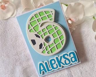 Birthday card featuring a 3D number "6" with a soccer ball theme on a blue background, "Aleksa" in b