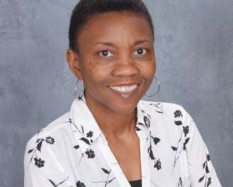 Photo of Michelle Wright in white blouse with black floral print